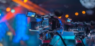 Is the future of sports broadcasting in the cloud? An image of a tv film camera on the set of an indoor sports event, showcasing sports broadcasting