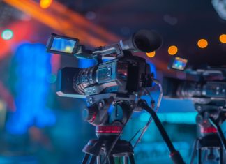 Is the future of sports broadcasting in the cloud? An image of a tv film camera on the set of an indoor sports event, showcasing sports broadcasting