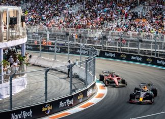 PwC’s F1 deal signals a broader shift in sport Two formula 1 cars racing during the 2023 Miami Grand Prix, two years before PwC and F1's partnership highlighted the importance of sports consulting