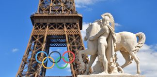 Paris 2024: Olympic spending shows state bore the brunt of costs Image of the Eiffel Tower with the Olympic Rings attached ahead of the Paris Olympics