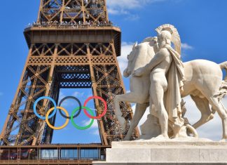 Paris 2024: Olympic spending shows state bore the brunt of costs Image of the Eiffel Tower with the Olympic Rings attached ahead of the Paris Olympics