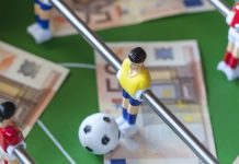 How IBIA is future-proofing Canadian sport integrity Football table with money on the top representing match-fixing