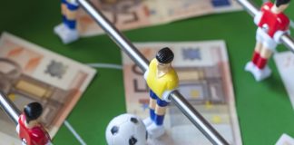 How IBIA is future-proofing Canadian sport integrity Football table with money on the top representing match-fixing