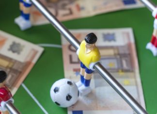 How IBIA is future-proofing Canadian sport integrity Football table with money on the top representing match-fixing