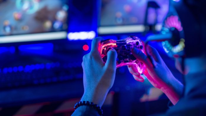 A person holding a controller, demonstrating how AI can help control live sport fan engagement