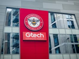 Brentford extends Hollywoodbets deal despite front-of-shirt ban LONDON- JULY 31, 2023: Brentford FC football stadium exterior logo in West London.
