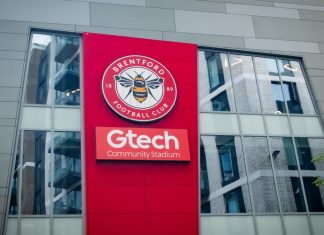 Meet Brentford FC’s new minority shareholders LONDON- JULY 31, 2023: Brentford FC football stadium exterior logo in West London.