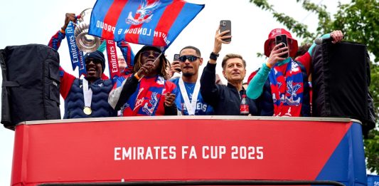London, UK, 26th May 2025, Crystal Palace players celebrate on an open top bus during the FA Cup trophy parade. Credit: Antony Medley.