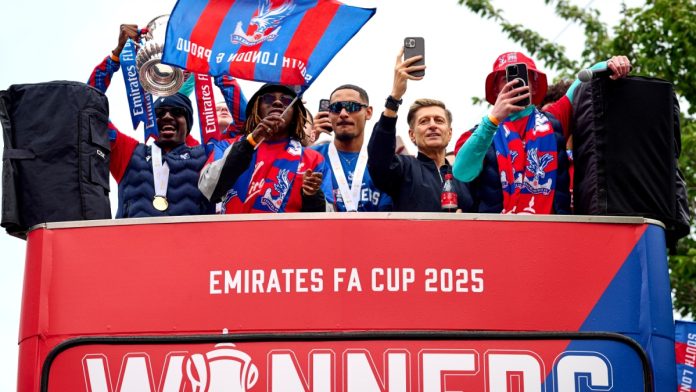 London, UK, 26th May 2025, Crystal Palace players celebrate on an open top bus during the FA Cup trophy parade. Credit: Antony Medley.
