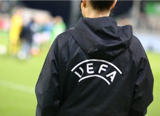 UEFA’s “regrettable” decision allows two domestic games abroad Wolfsburg, Germany, March 27, 2019: official UEFA assistant referee during UEFA Champions League game at AOK Stadion.