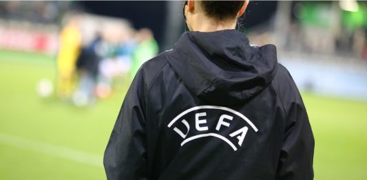 Wolfsburg, Germany, March 27, 2019: official UEFA assistant referee during UEFA Champions League game at AOK Stadion.