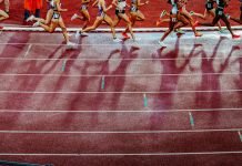 Q&A: England Athletics’ CEO on the commercial balancing act Legs of female athletics participants running on a track