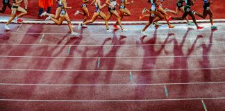Q&A: England Athletics’ CEO on the commercial balancing act Legs of female athletics participants running on a track
