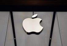 Apple rumour grows as Manchester United nears partner hat‑trick 11 April 2015 - Istanbul, Turkey: Apple Store logo. It is being suggested the company might partner with Manchester United.