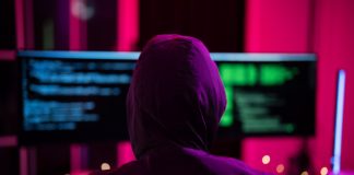 LaLiga blasts pirate streams as cybercrime gateways Black Hat Hacker hoodie concept at a laptop computer hacking the Internet. Cyber crime and security principles.