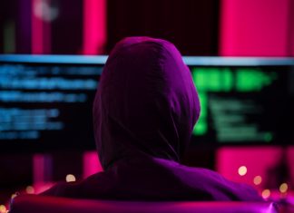 LaLiga blasts pirate streams as cybercrime gateways Black Hat Hacker hoodie concept at a laptop computer hacking the Internet. Cyber crime and security principles.