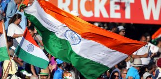 Indian sports revenue could shift amid Google and Meta probe India fans wave their national flags during the Pool B Cricket World Cup match between India and Ireland at Sedden Park in Hamilton on March 10, 2015. AFP PHOTO / Michael Bradley.
