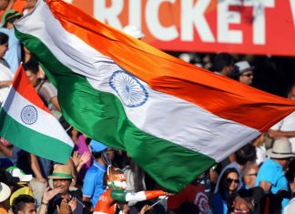 Indian sports revenue could shift amid Google and Meta probe India fans wave their national flags during the Pool B Cricket World Cup match between India and Ireland at Sedden Park in Hamilton on March 10, 2015. AFP PHOTO / Michael Bradley.