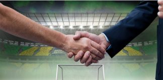 Should the WSL embrace joint deals like La Liga? Composition of businessmen shaking hands over sports stadium. sports, deal, agreement and competition concept digitally generated image.