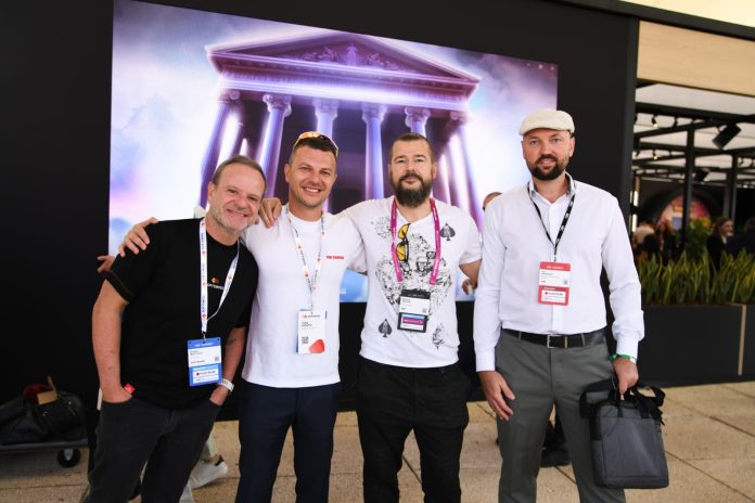 WhatsApp-Image-2025-09-17-at-16.35.43 Image of Rubens Barrichello with SOFTSWISS founder and CEO van Montik and Rasmus Sojmark, CEO of SBC