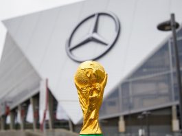 World Cup fever expected to lift UK sports by £3.1bn THE USA, ATLANTA, 17 OCTOBER 2019: World Cup FIFA on background Mercedes-Benz Stadium in Atlanta state of Georgia. FIFA World cup of football will takes in North America and South America in 2026.