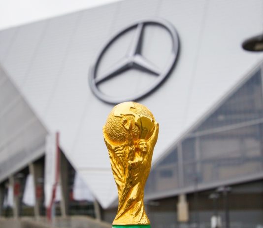 World Cup fever expected to lift UK sports by £3.1bn THE USA, ATLANTA, 17 OCTOBER 2019: World Cup FIFA on background Mercedes-Benz Stadium in Atlanta state of Georgia. FIFA World cup of football will takes in North America and South America in 2026.