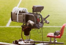 Northern Premier League streaming dispute explained Television broadcast camera shooting at a sunny football game.