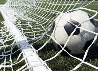 BOXXER’s Ben Shalom enters the pitch with new football agency Goal in the back of net in soccer game. Representing the Baller league withdrawing from Germany