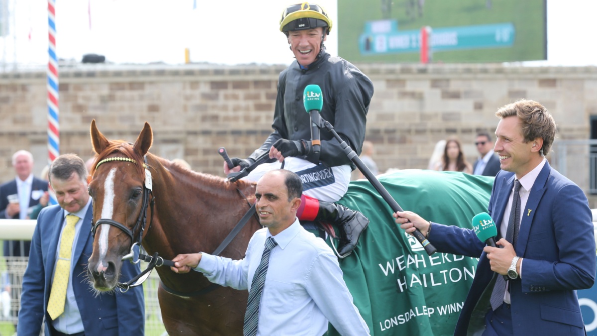 YORK RACECOURSE, YORK, UK : 20 August 2021 : Frankie Dettori on Stradivarius is interviewed by Ollie Bell from ITV Racing after winning the Group 2 Lonsdale Cup at York Races.