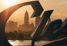 Cleveland Guardians’ Luis Ortiz charged in MLB betting scandal Cleveland skyline behind the Cleveland script sign at Sunrise, moody morning sunrise, midwest city, Browns, Guardians (MLB), City