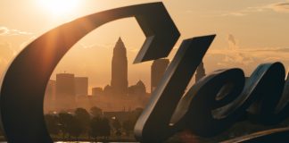 Cleveland Guardians’ Luis Ortiz charged in MLB betting scandal Cleveland skyline behind the Cleveland script sign at Sunrise, moody morning sunrise, midwest city, Browns, Guardians (MLB), City