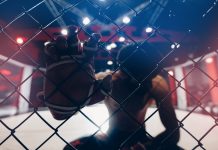 OKTAGON says fighters won’t risk match-fixing Portrait man MMA fighter on octagon ring. Fighting Championship, dark background.