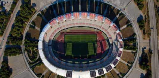 Aerial view photo from flying drone at Saint Nicholas Stadium, the home stadium of S.S.C. Bari, football club in south Italy. Drone photo of Stadio San Nicola di Bari, Puglia.