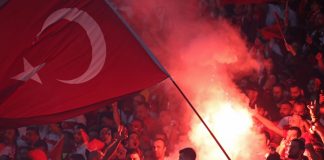 Beşiktaş speaks out as Turkish football scandal spreads Berlin, Germany - July 6, 2024: Turkish supporters burn flares during the UEFA EURO 2024 quarter-final game Netherlands v Turkey at Olympiastadion in Berlin, Germany.