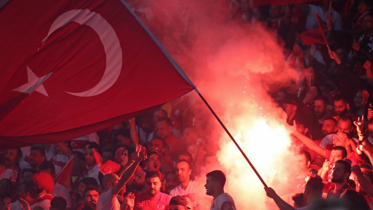 Berlin, Germany - July 6, 2024: Turkish supporters burn flares during the UEFA EURO 2024 quarter-final game Netherlands v Turkey at Olympiastadion in Berlin, Germany.