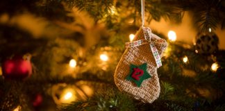 12 Days of Christmas: A year in sport Traditional Advent Calendar Stocking with the date of the twelfth of December hanging on a traditional christmas tree.