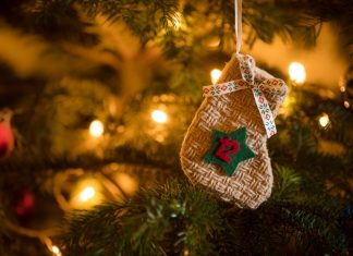 12 Days of Christmas: A year in sport Traditional Advent Calendar Stocking with the date of the twelfth of December hanging on a traditional christmas tree.