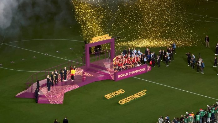 2023FWWC_Final_(celebration) Spanish female players celebrating with the 2023 FIFA Women's World Cup trophy. This photo was taken at the Stadium Australia in Sydney, New South Wales.