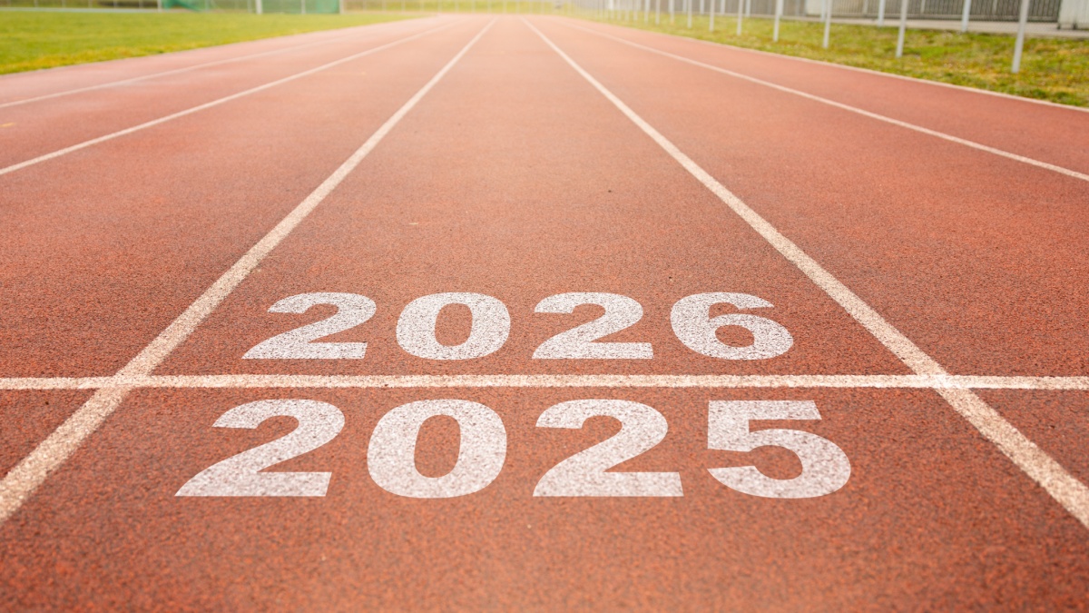 Start of new year. Changes of year 2025, 2026, 2027 on Running track. Concept of new ideas starting in new year, planning along with setting objectives to set KPI goals for success in life.