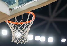 EuroLeague shrugs off NBA’s European investor hype Basketball hoop hanging in a sports stadium waiting for the ball.