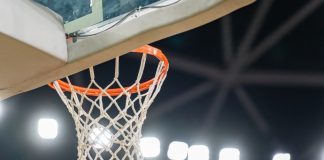 Terry Rozier denies role in NBA player-prop betting scheme Basketball hoop hanging in a sports stadium waiting for the ball.
