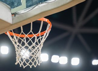 EuroLeague shrugs off NBA’s European investor hype Basketball hoop hanging in a sports stadium waiting for the ball.