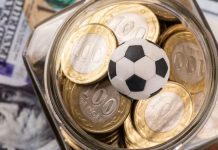 885 Capital: Baller League and the future of sports investing Symbolic soccer ball, 100 KZT coins and 100 US dollar bills.
