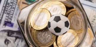 885 Capital: Baller League and the future of sports investing Symbolic soccer ball, 100 KZT coins and 100 US dollar bills.