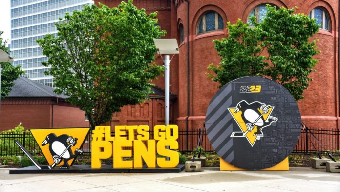 Pittsburgh-Penguins Pittsburgh, PA, USA- May 20, 2023: Promotional display for the NHL team Pittsburgh Penguins outside the Paints Arena in Pittsburgh.