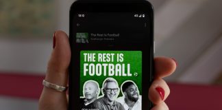 Will Gary Lineker feature in Netflix’s World Cup coverage? Hebden Bridge, West Yorkshire UK. August 17, 2023. The Rest is Football podcast playing on a Google Pixel 4 mobile phone. Woman's hand with red nails. Episode Harry Kane with Gary Lineker.