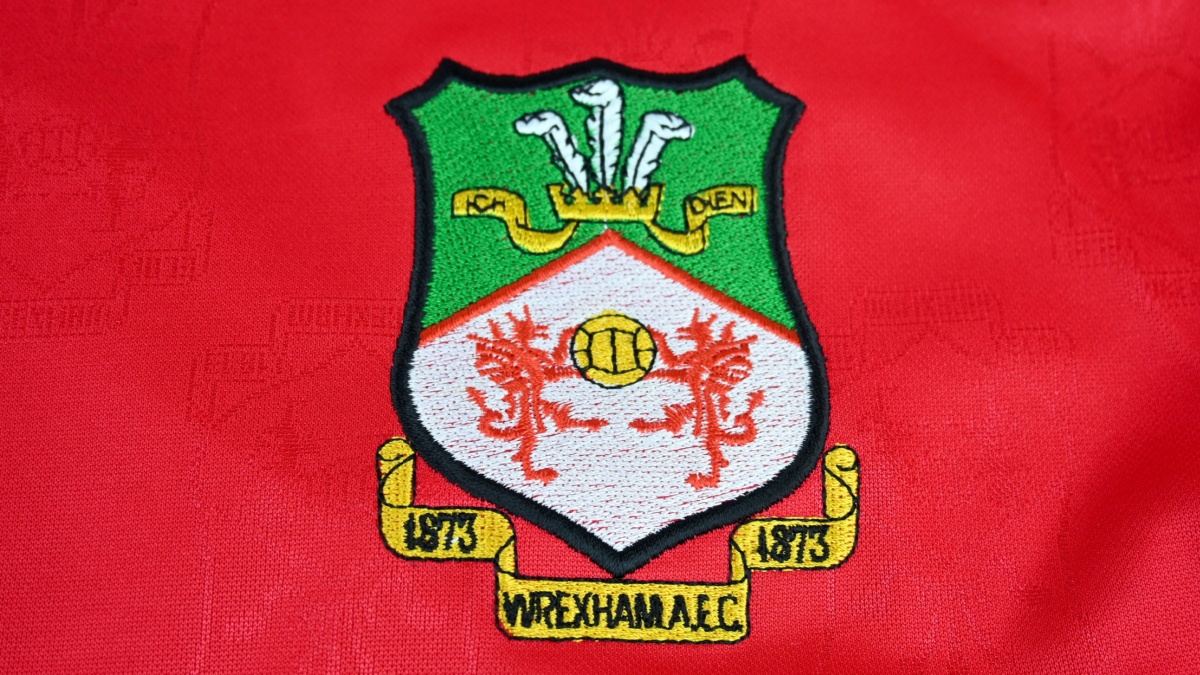 Close up of Wrexham AFC badge on 2001-02 home kit jersey – Wales, UK – 9 January 2024.