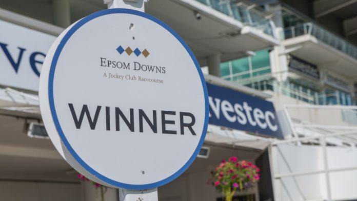 epsom-downs Epsom Downs,Surrey / England - August 4th 2018: Winner sign at the famous Epsom Downs Race course, which is owned by the Jockey Club and best known for hosting the Derby Stakes.