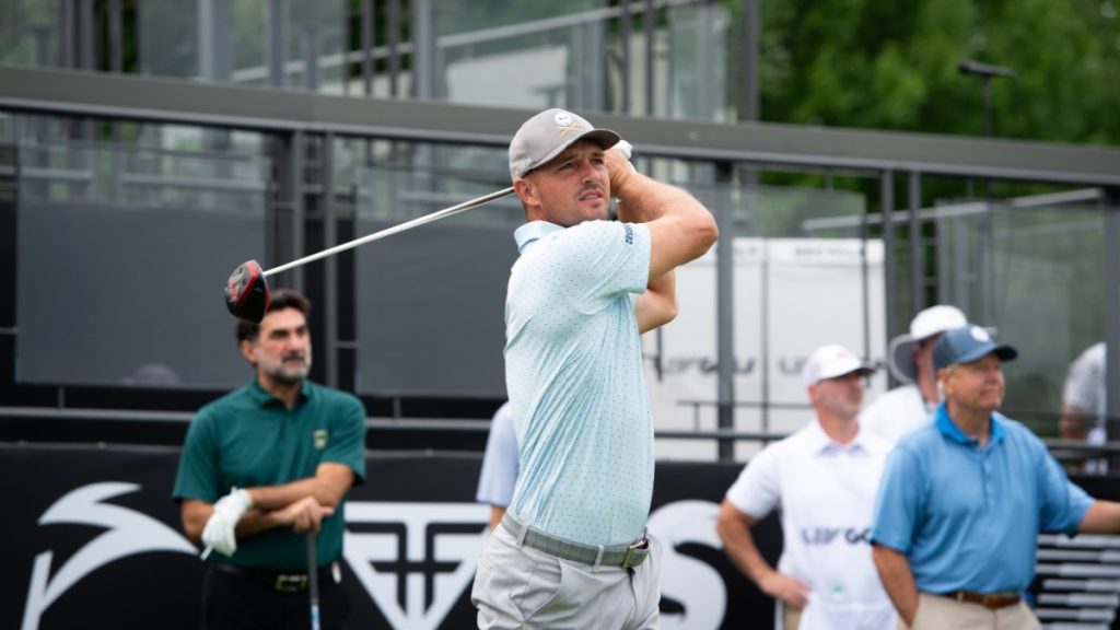 BEDMINSTER,NJ-August 10, 2023: Bryson DeChambeau watches his shot down the 1st Tee fairway at the start of the LIV Pro-Am held at the Trump National Golf Club in Bedminster,NJ.
