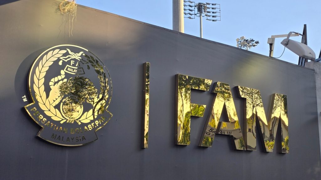 KUALA LUMPUR, MALAYSIA – June 12, 2025: Golden 3D lettering of the Football Association of Malaysia (FAM) logo and acronym is displayed at the entrance of the FAM sports complex.

